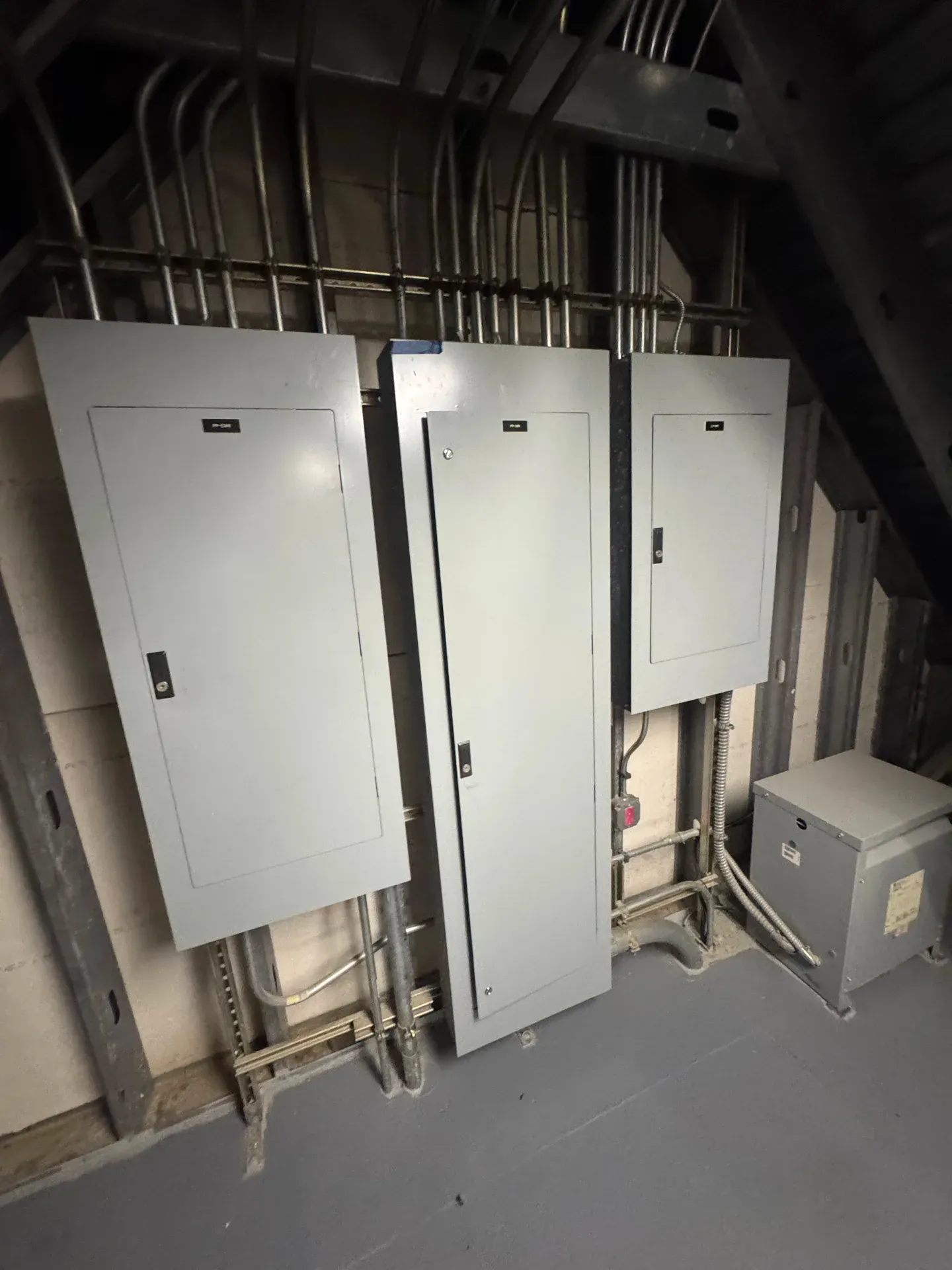 Commercial distribution panelboard bank in mechanical room